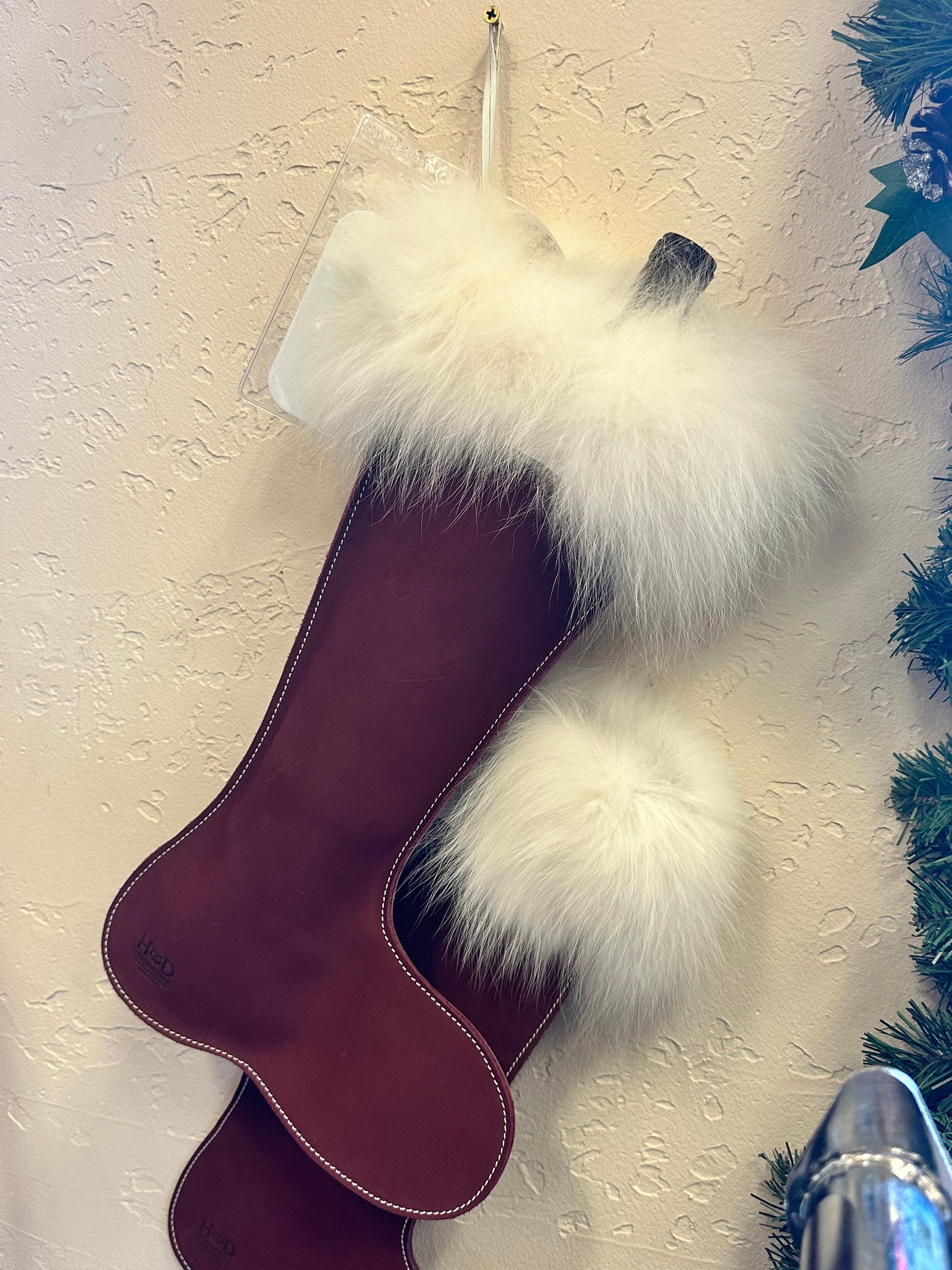 Red leather Christmas stocking with arctic fox fur