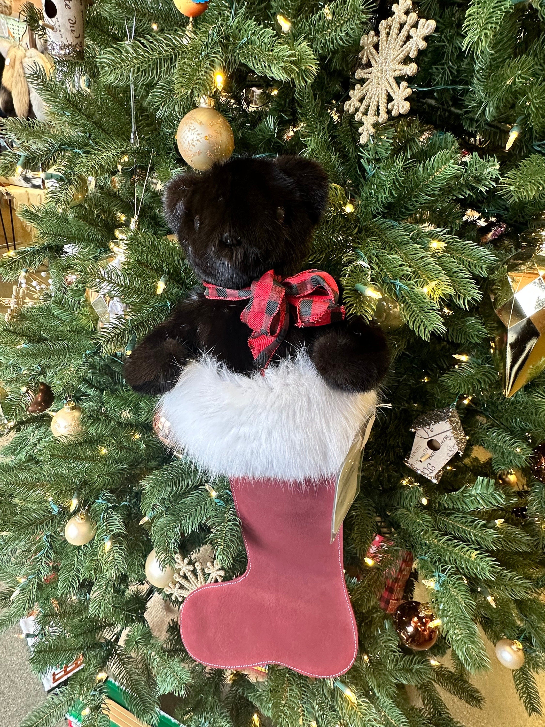 Red leather Christmas stocking with arctic fox fur